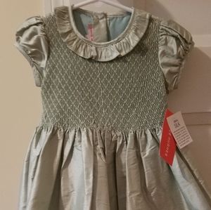 Beautiful Kaycee Hughes 100% silk smocked dress.